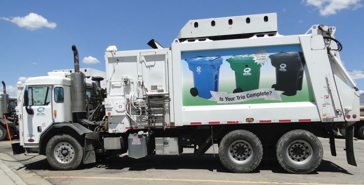 Wasatch Front Waste and Recycling District collection truck servicing garbage and recycling containers